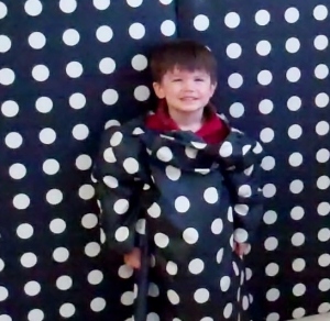 Eliot dressed to 'disappear' into the polka dot wall